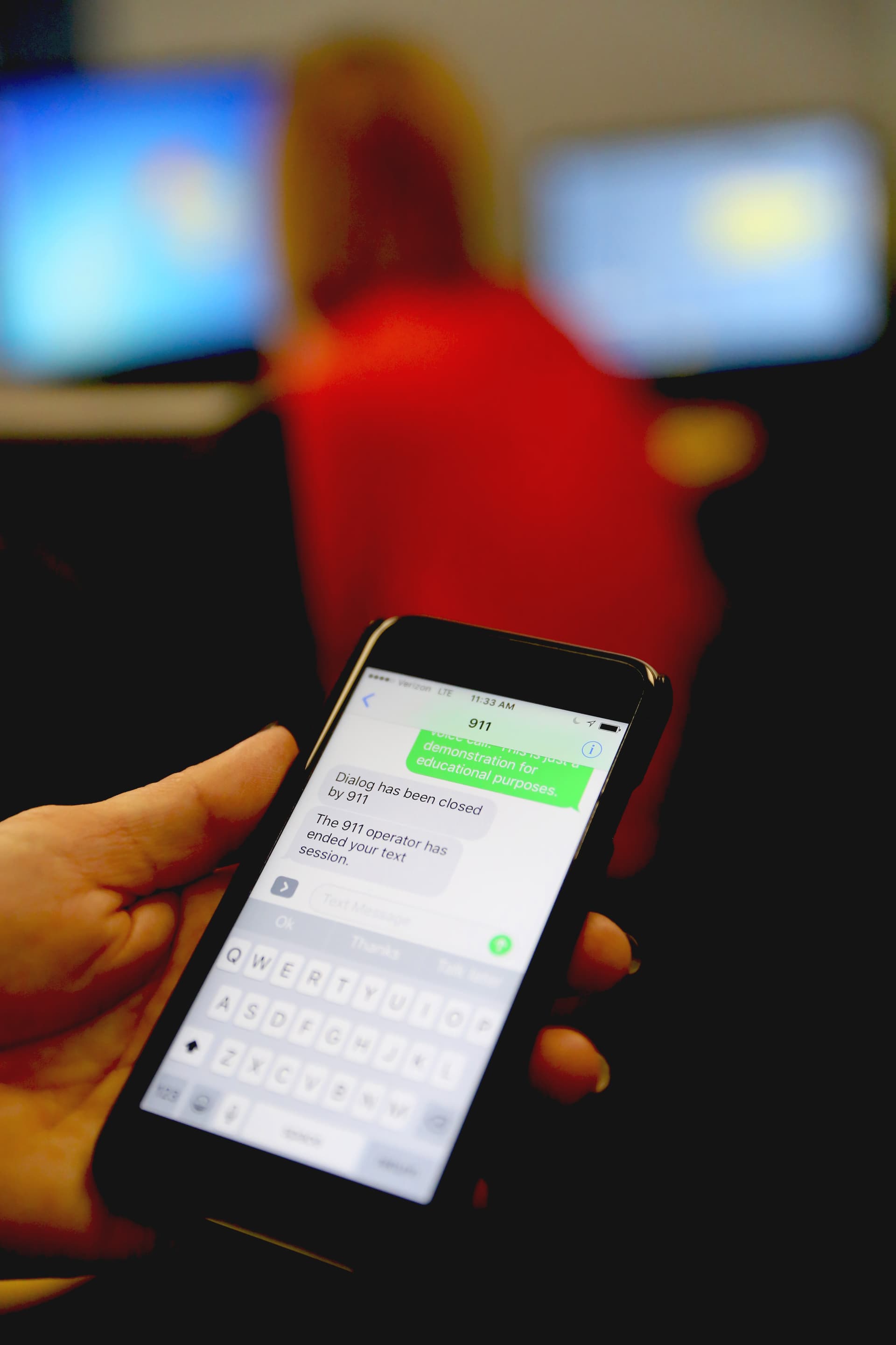 Cell phone showing someone texting to 911