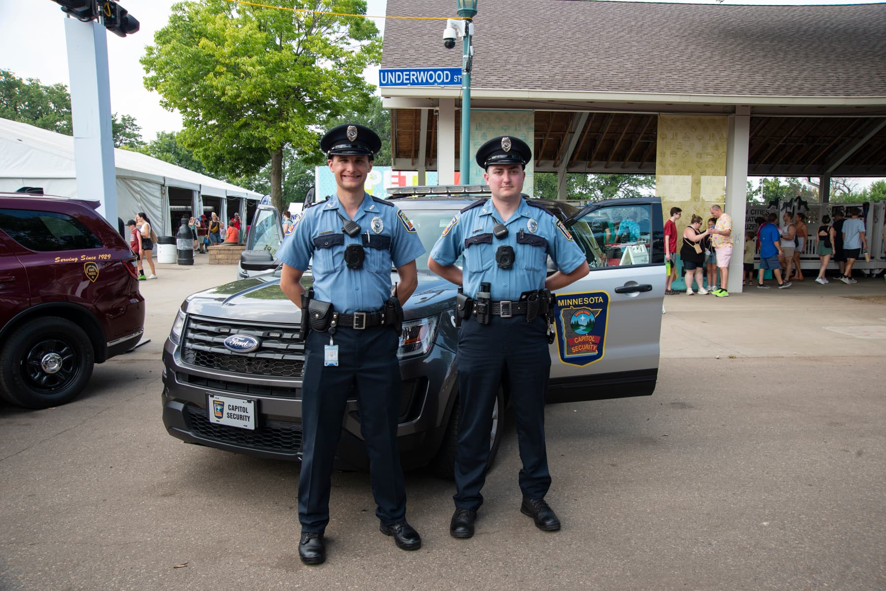 Two Capitol Security Standing in front of squad